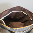 Load image into Gallery viewer, Brown bag with a patterned interior on a light gray background
