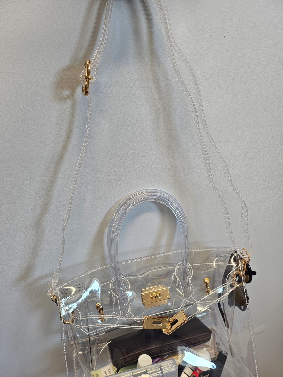Clear crossbody purse.