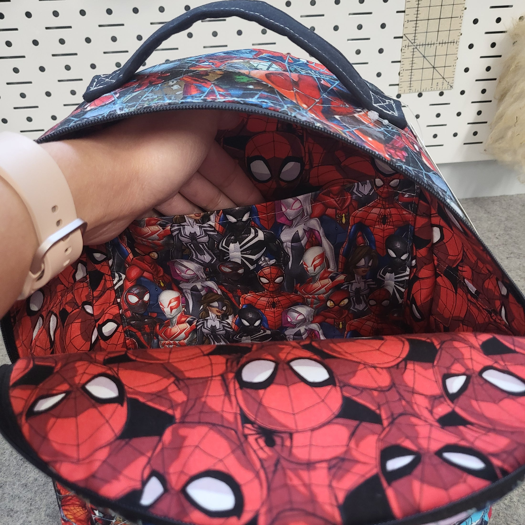 Interior pocket of spiderman backpack.