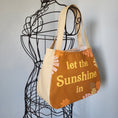 Load image into Gallery viewer, Let the sunshine in shoulder purse.
