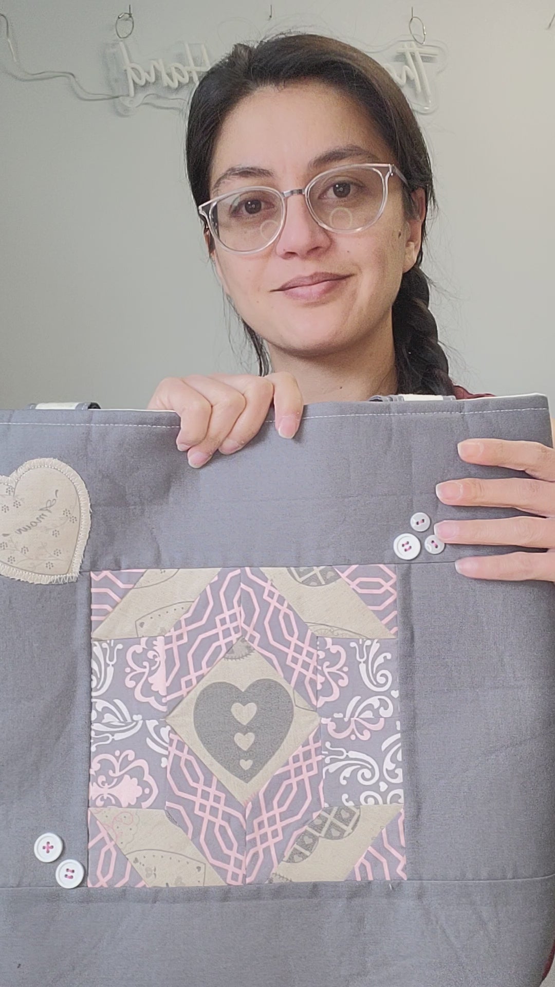 Video of the quilted heart tote with appliqued hearts and handsewn buttons.
