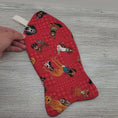Load and play video in Gallery viewer, Video of fish shaped rescued pet holiday stocking.
