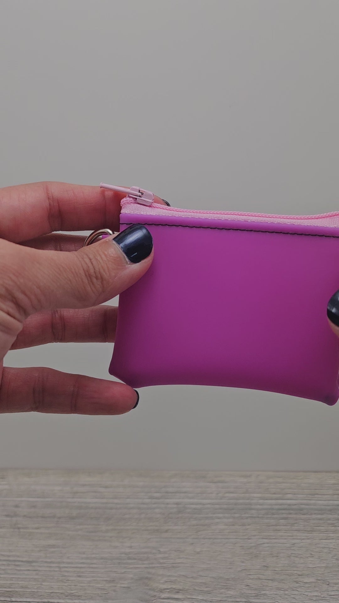 Video of the mini pink vinyl zipper pouch.