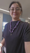 Load and play video in Gallery viewer, Short video of person showing off a purple skinny scrunchie lanyard.
