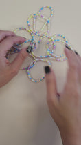 Load and play video in Gallery viewer, Video of the Easter themed friendship bracelets. 
