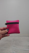 Load and play video in Gallery viewer, Video of the mini pink zipper pouch with d ring. 
