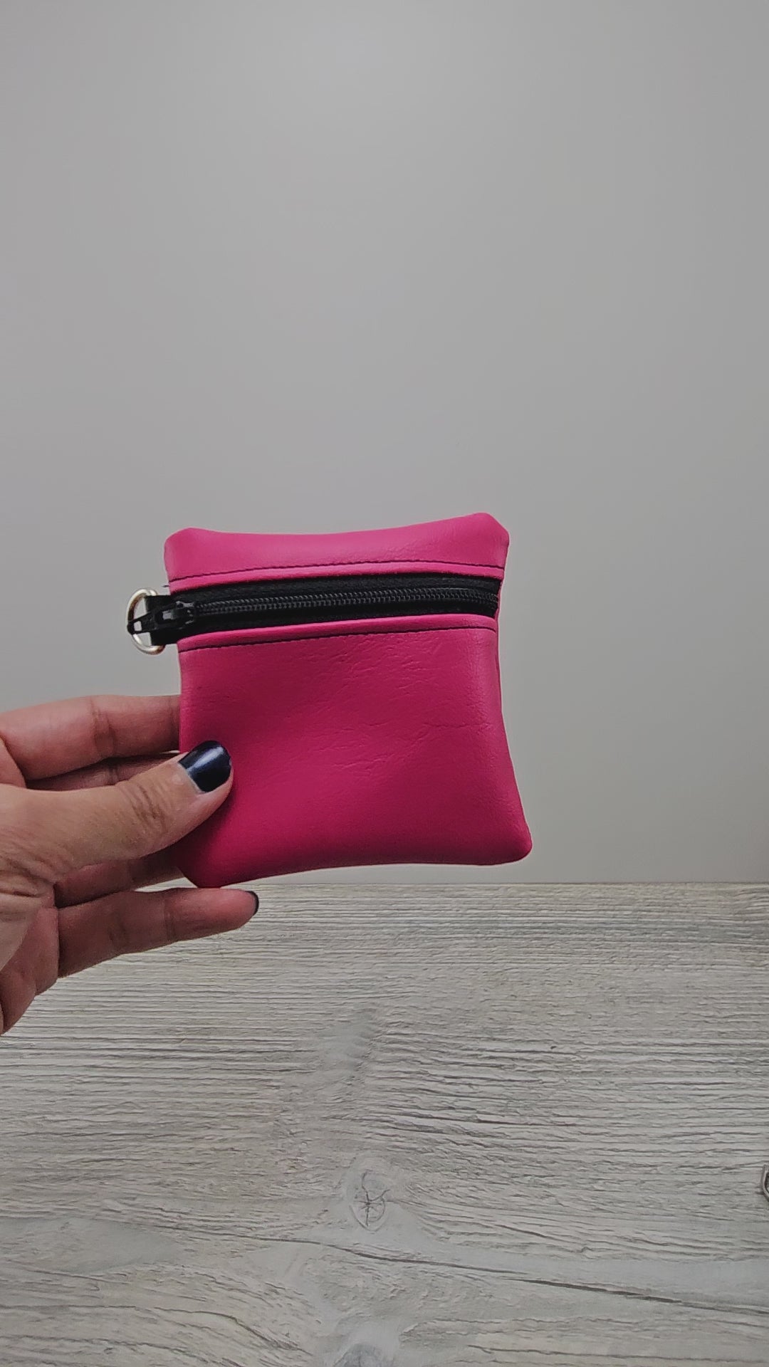 Video of the mini pink zipper pouch with d ring. 