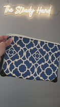 Load and play video in Gallery viewer, Video of blue and cream wristlet clutch.
