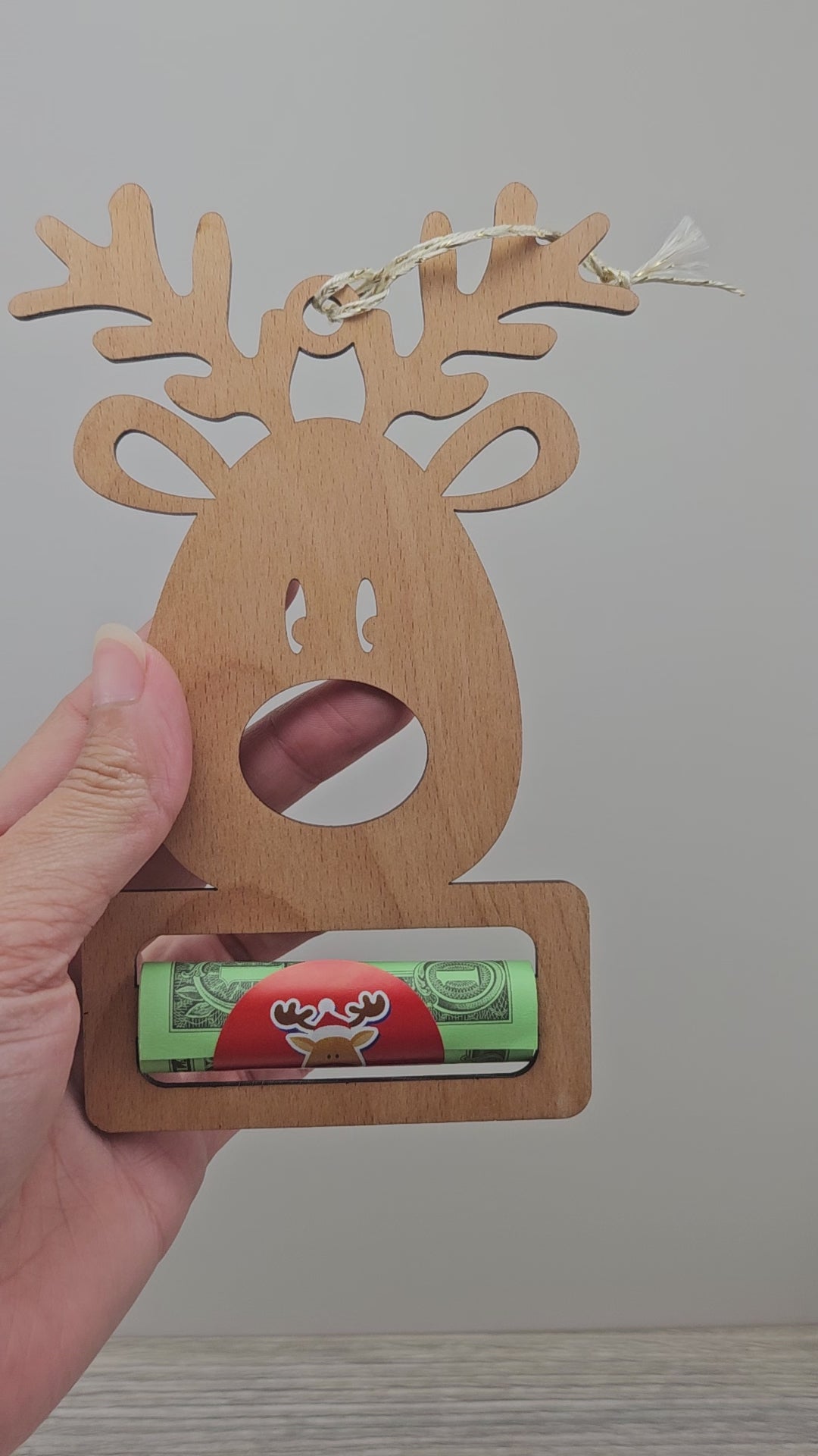 Video of reindeer shaped ornament money holder gift. 