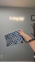 Load and play video in Gallery viewer, Video of blue and cream wristlet clutch.
