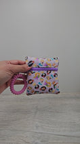 Load and play video in Gallery viewer, Video of the mini disney princess inspired wristlet pouch. 
