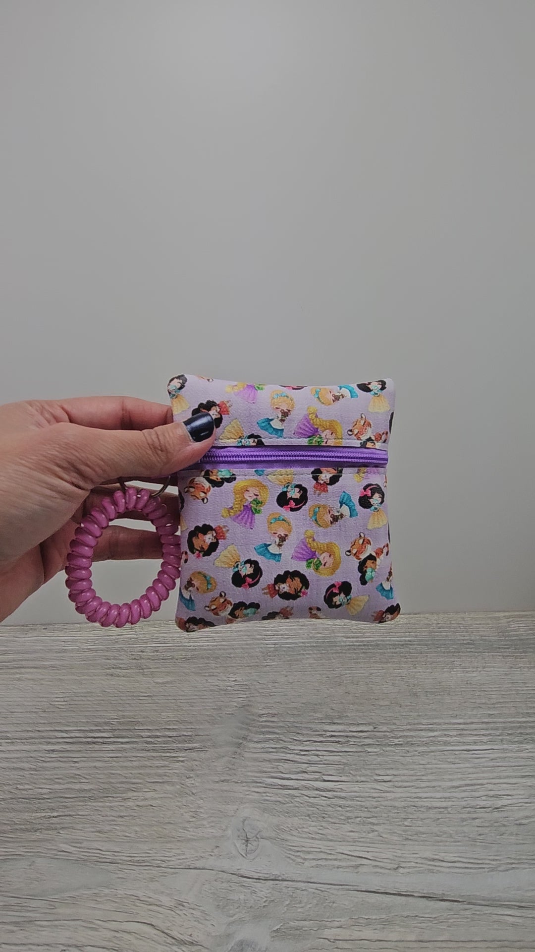 Video of the mini disney princess inspired wristlet pouch. 