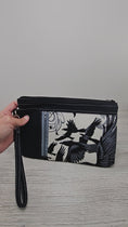 Load and play video in Gallery viewer, Video of the crows zippy clutch wristlet wallet.
