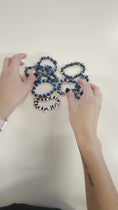 Load and play video in Gallery viewer, Video of stretch bracelets made with rocks and metallic sheen beads. 
