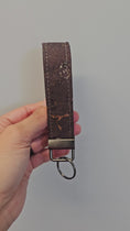 Load and play video in Gallery viewer, Video of brown and gold cork key fob.
