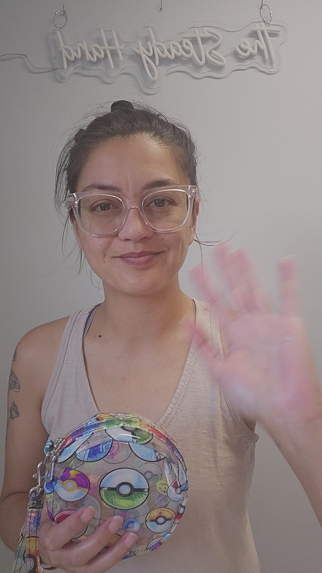 Video of poke ball clear vinyl circle pouch.