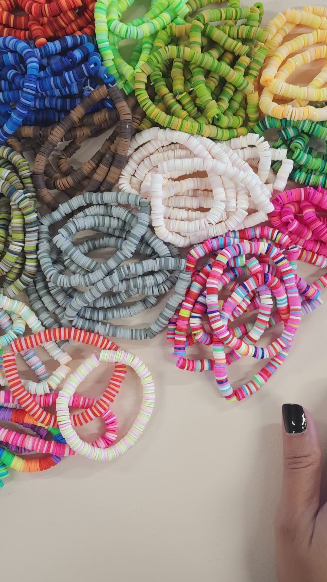 Video of the colorful clay bead stretch bracelets. 