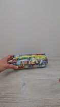 Load and play video in Gallery viewer, Video of clear vinyl pencil pouch with disney parks.
