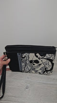 Load and play video in Gallery viewer, Video of Skull zippy clutch.
