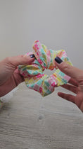 Load and play video in Gallery viewer, Video of the rainbow gummy bears scrunchie.
