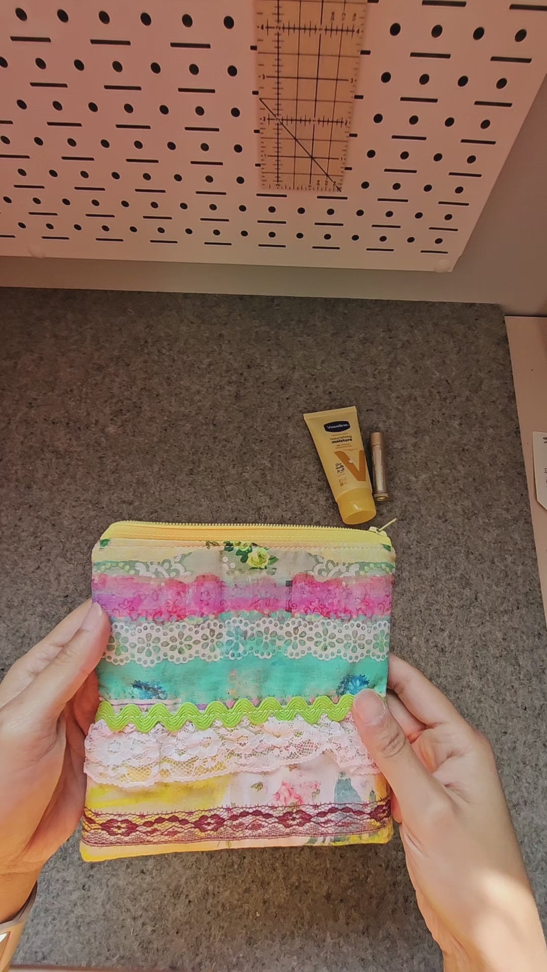 Video of the Watercolor lace zipper pouch embellished with white lace and green rick rack.