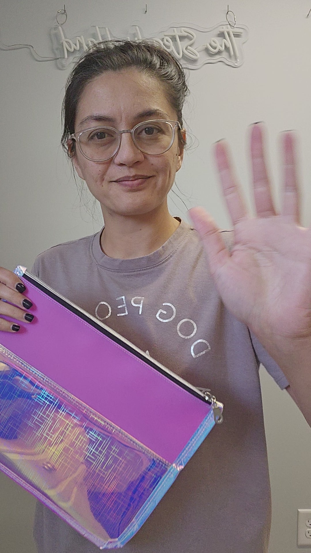 Video of the transparent holographic pink large flat zipper pouch.