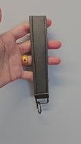 Load and play video in Gallery viewer, Short video of heavy duty grey key fob.
