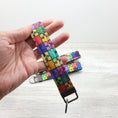 Load image into Gallery viewer, Rainbow puzzle pieces key fob.
