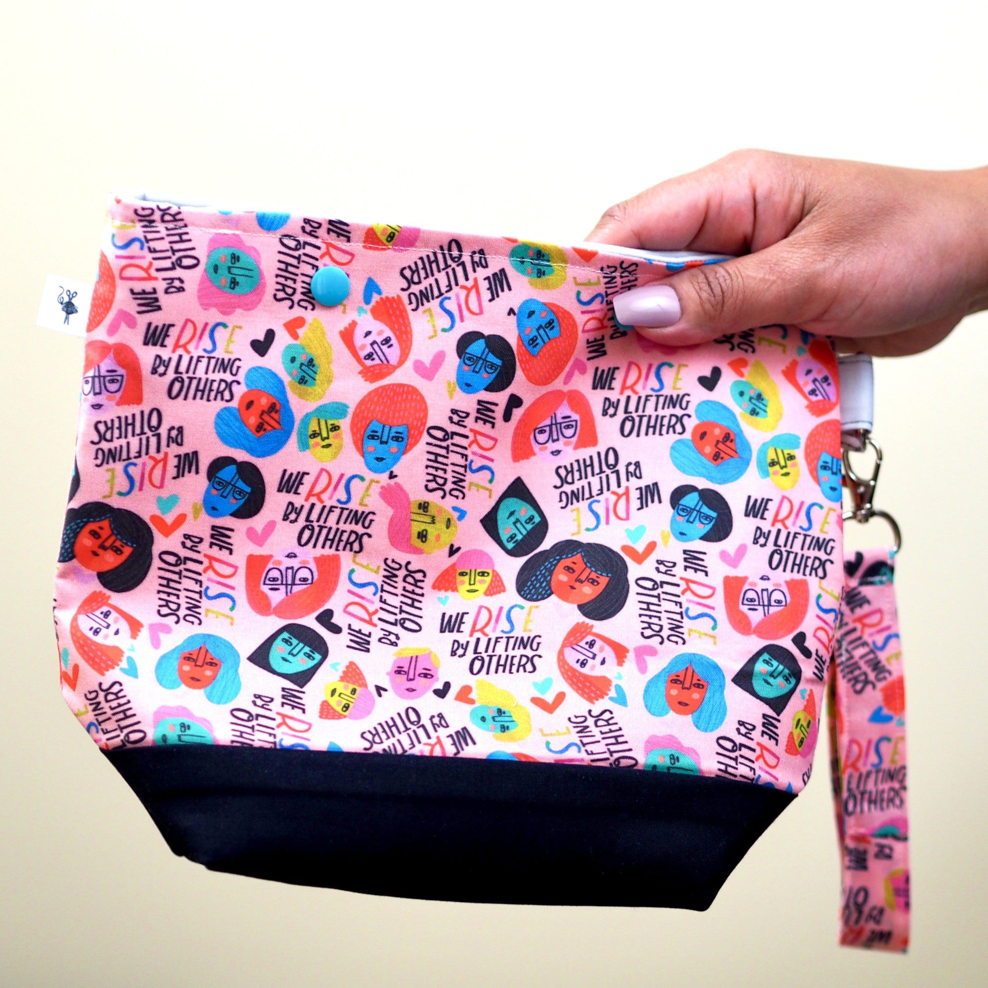 We rise by lifting others snap project pouch.