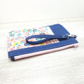 Load image into Gallery viewer, Blue and pink wristlet. 
