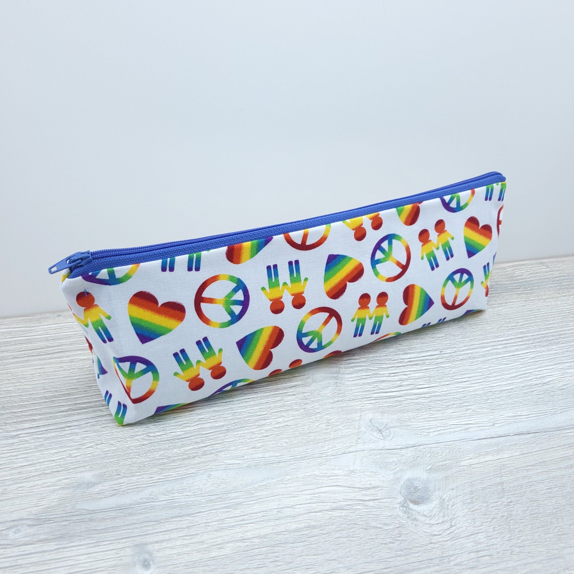 Long zipper pouch with rainbows.