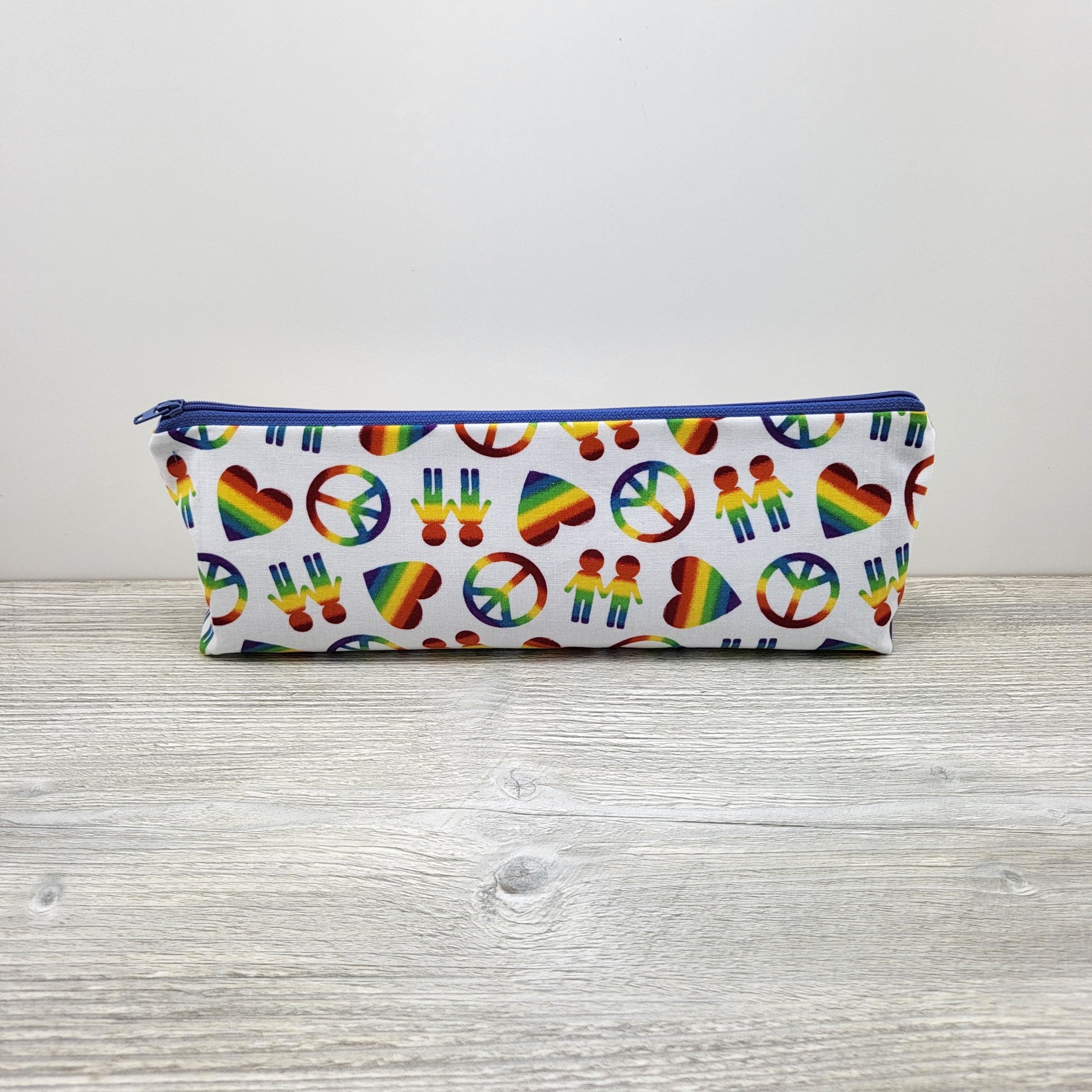 Pencil pouch white with rainbows. 